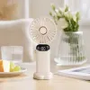 The portable silent small fan with a white handheld fan and a charging base has a long battery life details Picture